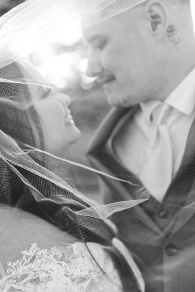 Black and white wedding photography, bride and groom veil shot, veil photography